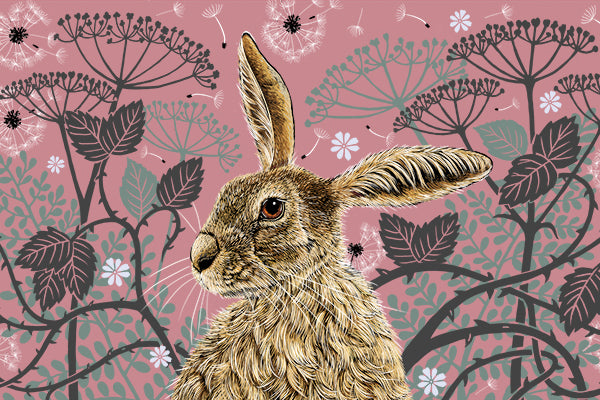 This tea towel design features a hare portrait with one floppy ear, around the hare are stylised brambles, leaves, cow parsley and dandelion puffs, background colour is a heritage pink.