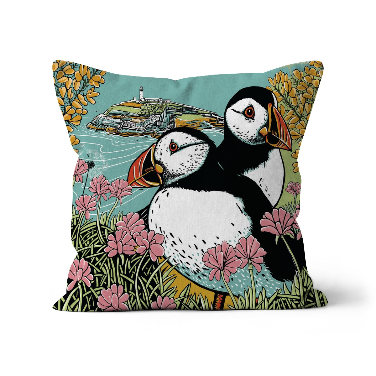 This Fox and Boo design features two puffins side by side on a clifftop, surrounded by sea thrift and gorse, backdrop is a small island with a lighthouse. 