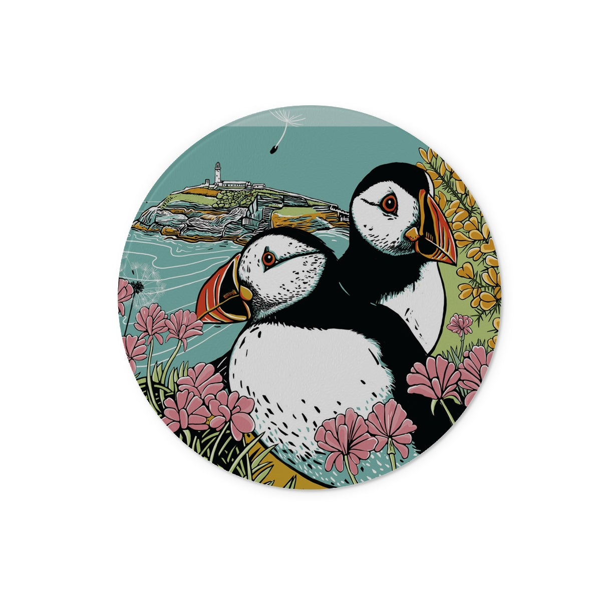 This Fox and Boo design features two puffins side by side on a clifftop, surrounded by sea thrift and gorse, backdrop is a small island with a lighthouse. 