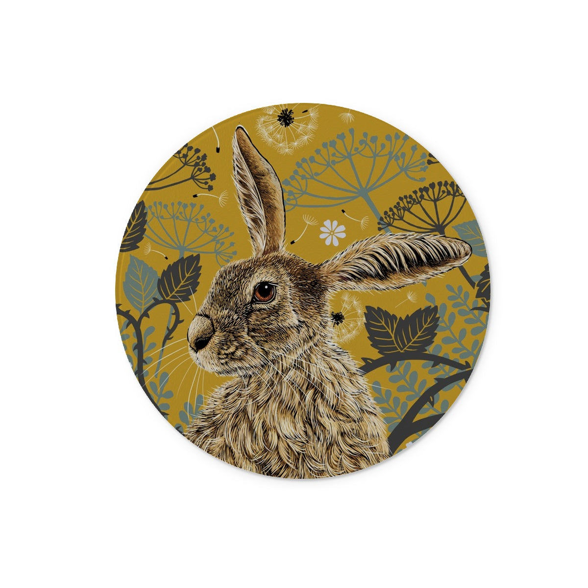 This round glass worktop saver design features a hare portrait with one floppy ear, around the hare are stylised brambles, leaves, cow parsley and dandelion puffs, background colour is a mustard yellow.